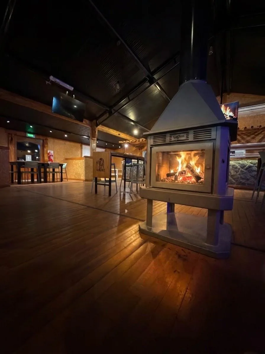 Kacike Parrilla dining room with wood fireplace